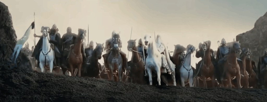 "Troopers of Rohan stand united on a hill, ready for battle, overlooking Helm's Deep."