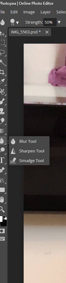 Photopea's left toolbar showcasing the smudge tool within the blur toolbox, is essential for comprehensive image optimization to enhance website speed.