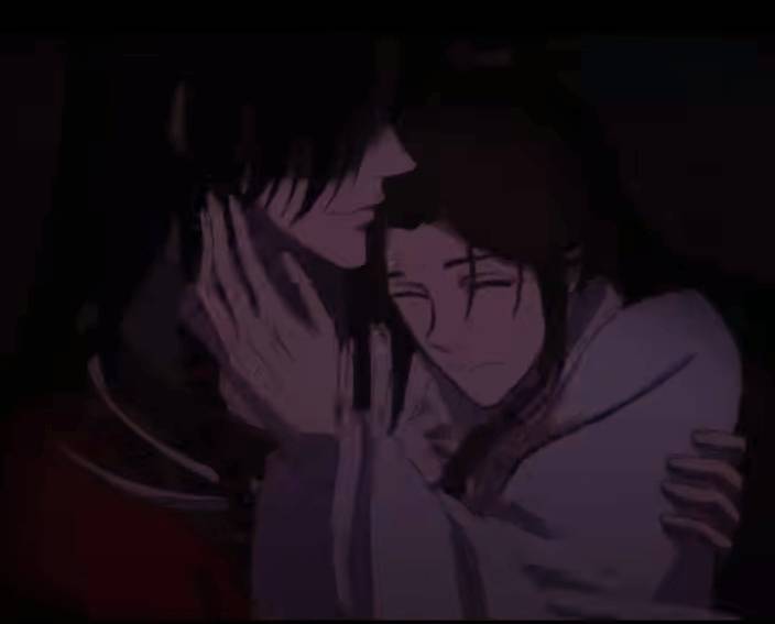 Hua Cheng carries Xie Lian close to his chest, with Xie Lian's hand gently touching Hua Cheng's neck.